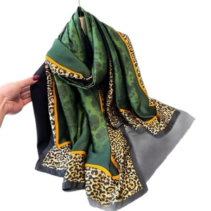 Green silk-like leopard floral long scarf shawl with elegant hanging display