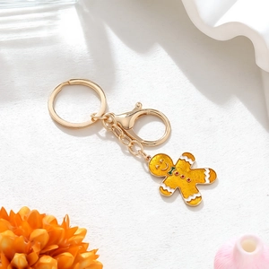 Portachiavi omino di pan di zenzero giallo glitterato con chiusura a moschettone