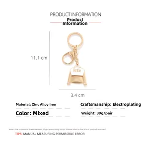 Detailed size chart for bride dress keychain showing 11.1cm height and 3.4cm width