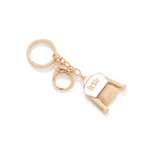Golden keychain with a bride dress pendant featuring white pearls and enamel finish
