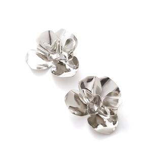 Dramatic oversized silver metallic 3D flower earrings with a vintage sculptural design