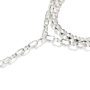 Luxurious silver layered necklace featuring polished oval rings and textured flat coffee bean links
