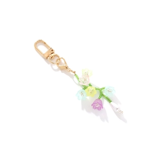 Porte-clés fleurs macaron colorées avec fermoir en métal doré et détail perle