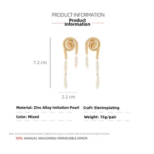 Detail showing dimensions of golden spiral earrings with baroque pearls and zinc alloy