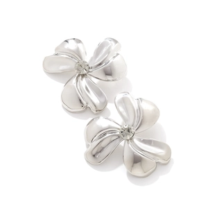 Polished silver metal flower stud earrings with sparkling cubic zirconia center stones