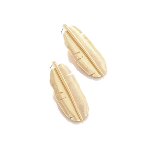 Exaggerated retro golden leaf earrings with intricate tropical banana leaf texture
