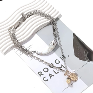 Multi-layer necklace with marble horn pendant, gold coin, and pearl in vintage style