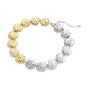 Marine style shell necklace with alternating gold and silver metal scallop charms