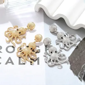 Exaggerated enamel octopus drop earrings in gold and silver finish with shell studs