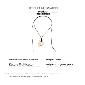 Detail showing vintage gold snake pendant with black wax cord and 130cm length specs