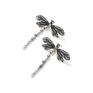 Vintage dragonfly dangle earrings with crystals and faux pearls on white background