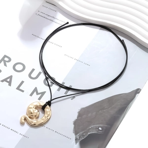 Vintage gold hammered snake pendant necklace with adjustable black cord for women