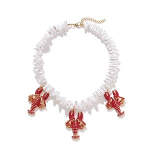 Baroque pearl bead necklace with three red enamel lobster pendants and gold metal edges