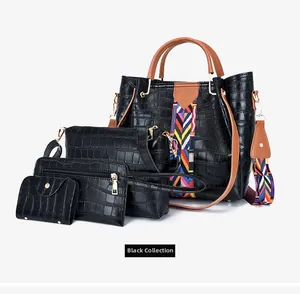 Detail of four-piece black crocodile pattern tote bag set with geometric wide strap