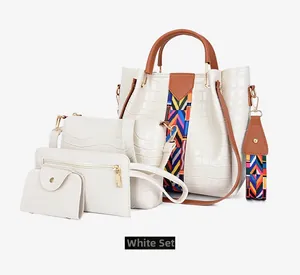 Detailed view of 4-piece white tote bag set with crocodile pattern and wide strap