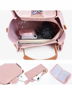 Pink crocodile texture handbag interior showing spacious compartments and storage capacity