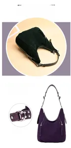 Detail of adjustable metal buckle and tassel on matte vintage crossbody handbag