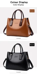 Dettaglio di eleganti borse in marrone e nero con finiture dorate e logo del marchio