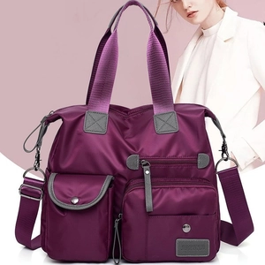 Purple nylon multi-pocket travel bag with shoulder strap for women, crossbody style