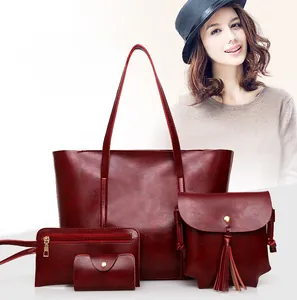 Détail de l'ensemble de 4 sacs bordeaux avec sac bandoulière à glands et porte-carte