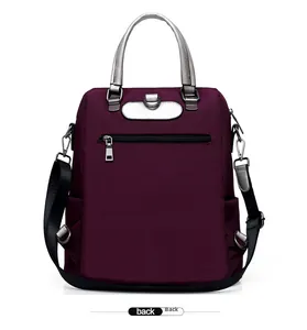 Vue arrière du sac à dos en nylon violet avec poche zippée et poignée en argent