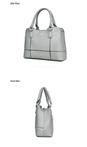 Vues latérales d'un sac à main gris en cuir grainé avec logo en métal et surpiqûres
