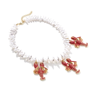 Baroque pearl necklace featuring red enamel lobster pendants and colorful crystal accents