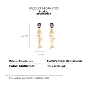 Detailed view of long alloy fishbone drop earrings with size measurements of 9.5cm