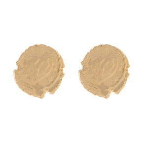 Detailed view of hammered gold coin earrings featuring a unique sunken heart texture