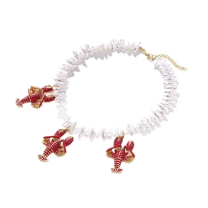 Baroque pearl necklace with red lobster pendants and colorful accents in marine style