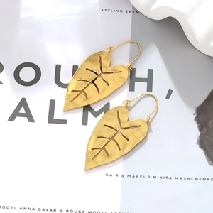 Golden monstera leaf earrings with hollow vein texture and vintage matte finish