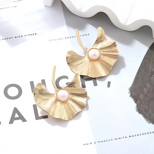 Vintage golden ginkgo leaf earrings with white pearl and detailed leaf vein texture