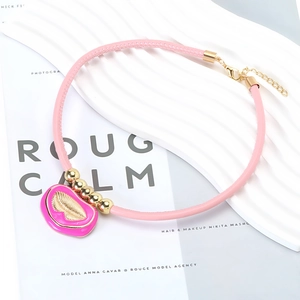 Pink PU leather choker necklace with hot pink enamel lip pendant and gold metal beads