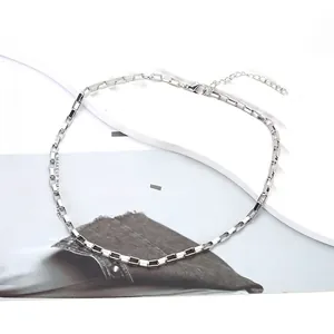 Detail of silver square link chain necklace with lobster clasp and adjustable length