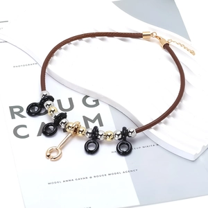 Luxe alloy geometric pendant necklace with brown PU cord and metallic accents