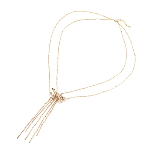 Golden double-layer dragonfly necklace with delicate tassel fringe on white background
