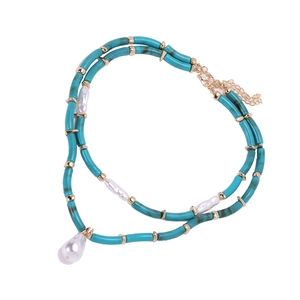 Multilayer beaded necklace with turquoise resin tubes, white baroque pearls and gold clasp