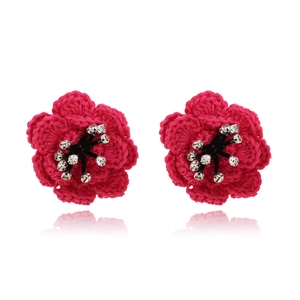 Handcrafted fuchsia crochet camellia earrings with white crystals on a white background