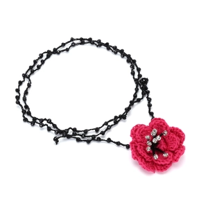 Handmade bohemian beaded necklace with large pink crochet flower and crystal center