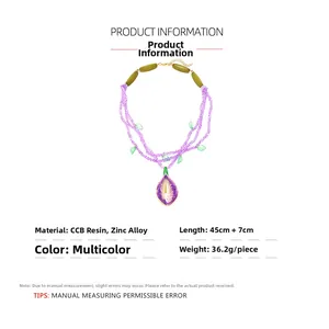 Detail of beaded purple resin necklace with golden horseshoe drop pendant and dimensions