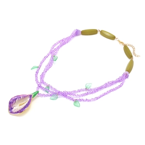 Three-layer purple crystal beaded necklace with calla lily pendant and green leaf accents