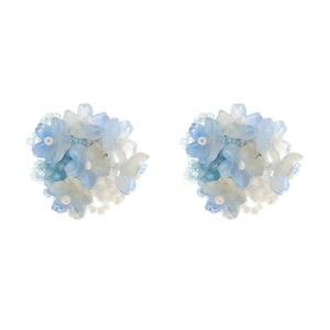 Handmade woven bead flower stud earrings in light blue and white bohemian floral style