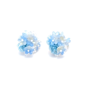 Handmade bohemian beaded flower stud earrings in light blue and white gradient