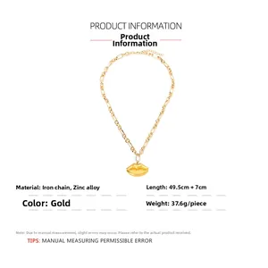 Detail of golden lip pendant necklace with chain length specifications and material details