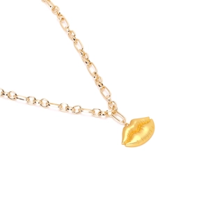 Vintage textured golden lip pendant necklace with chunky links on white background