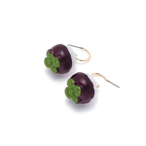 Detailed view of purple mangosteen fruit drop earrings with green leaf and golden hooks