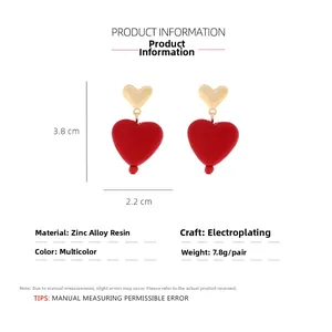 Detail showing dimensions of red resin heart earrings with gold alloy studs