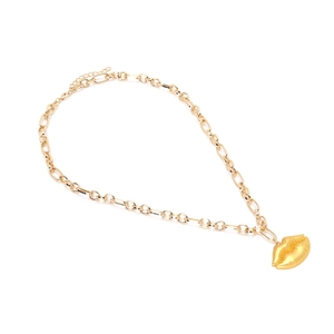 Vintage gold-finish metal necklace featuring a bold lip pendant on a thick link chain