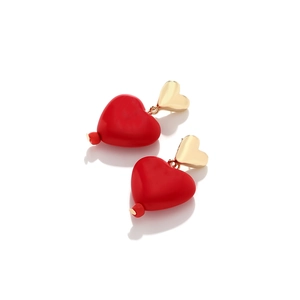 Chic gold heart stud earrings with vibrant red resin heart pendants on a white background