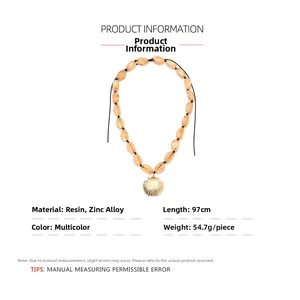 Detail of yellow resin beads and golden shell pendant on a 97cm long knotted necklace